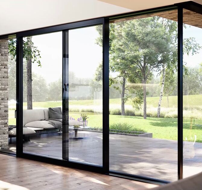 Floor-to-ceiling sliding glass doors opening to a patio